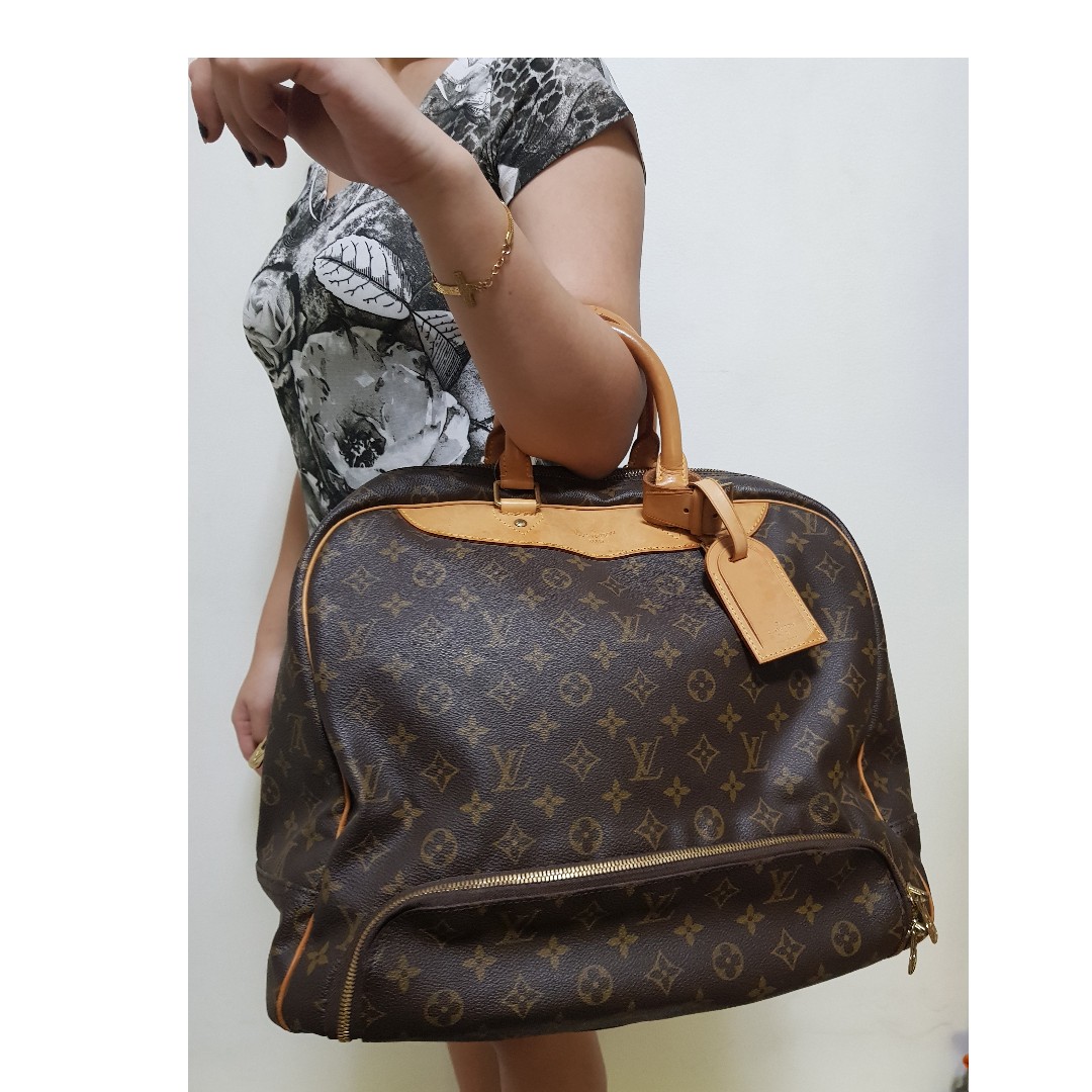 LOUIS VUITTON MONOGRAM CANVAS EVASION TRAVEL BAG Luxury Bags