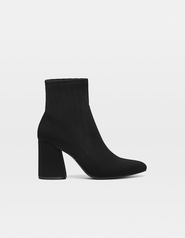 Heeled ankle black boots with contrasting sock detail from Stradivarius Women s Fashion Footwear Boots on Carousell