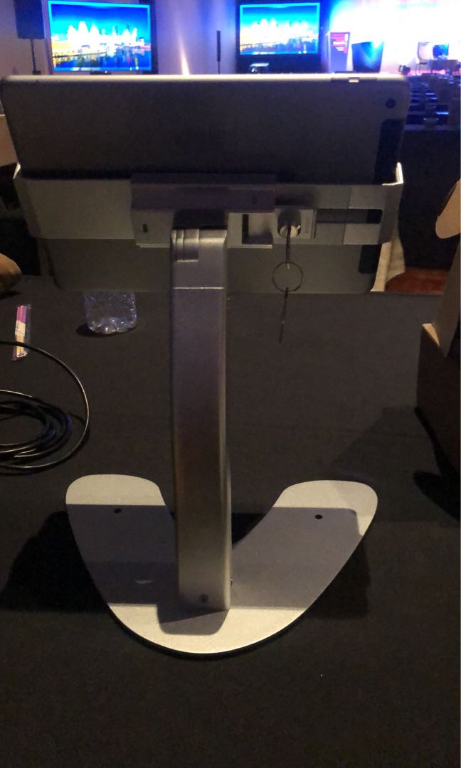 Ipad stand (Category: Mounts & Holders) located in Singapore. Submitted by littleboyboy8888 (Listing ID 238188002, Image 2). Description: Bought at $85 each, used for a one day event only, selling at $55 each, currently have 10 pieces. Comes with a key. Looks as good as new. Location of deal can be flexible..