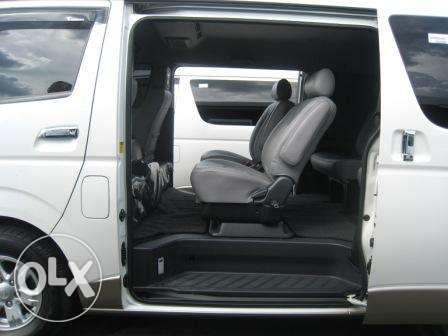 White Toyota Super Grandia Van for Rent with Captain Seats