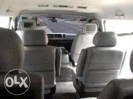 White Toyota Super Grandia Van for Rent with Captain Seats