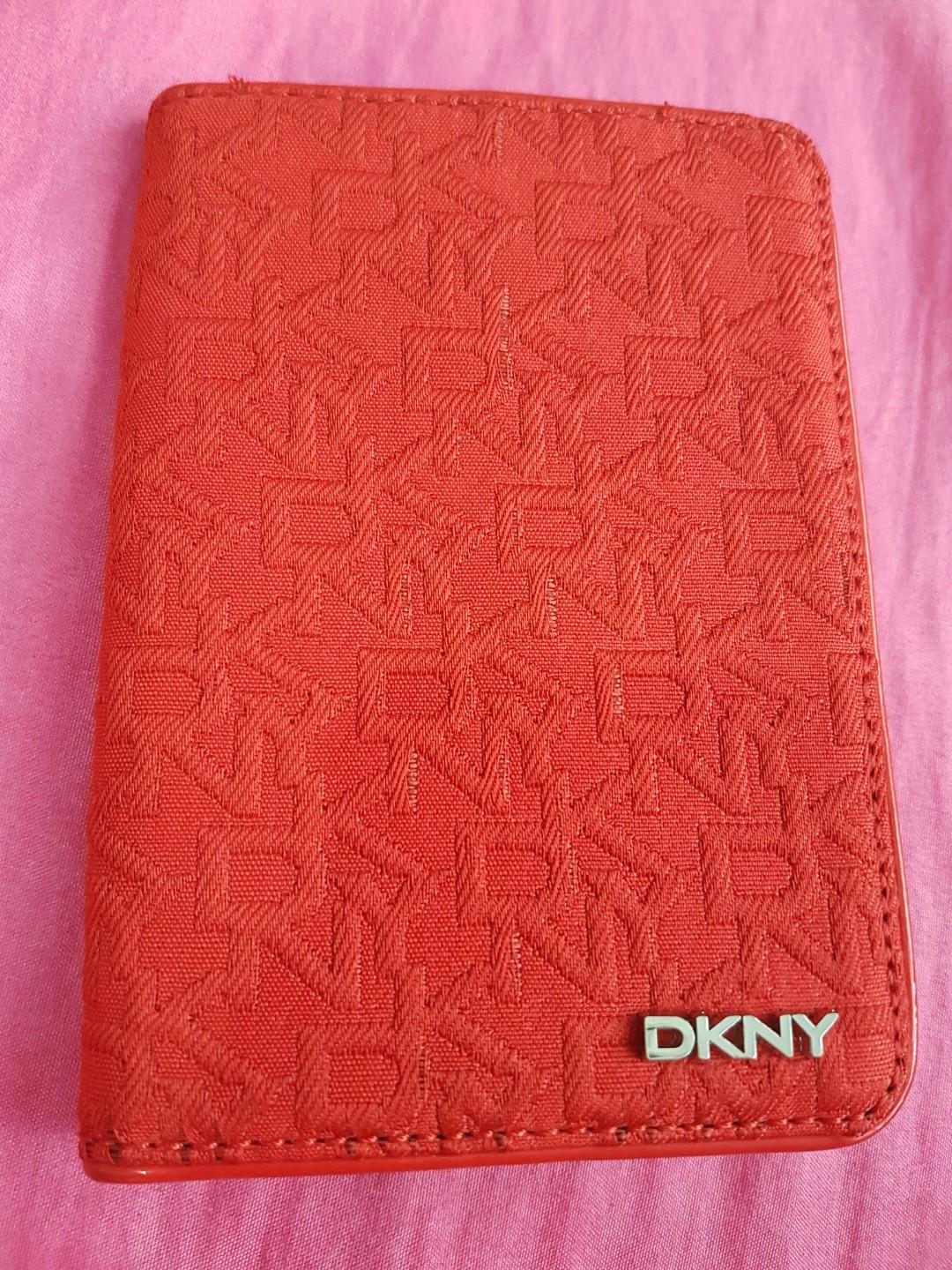 DKNY Passport Holder (Category: Luxury Bags & Wallets) located in Paranaque City. Submitted by mamaalphaecho (Listing ID 238403888, Image 1). Description: = READ THE ENTIRE AD PRIOR TO INQUIRY. Click READ MORE below = Purchased in the US. Color: red. Material: monogrammed fabric and faux patent leather. Used 2-3x max. In good condition. Has stains on the patent leather that don't affect the function of the holder (see images). This is a used item
