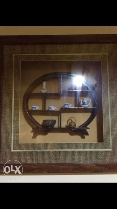 Antique Wall Decor Frame (Category: Frames & Pictures) located in Manila. Submitted by ubergoods (Listing ID 238552098, Image 2). Description: Antique Wall Decor with mini Ceramic vases inside 8 miniatures of Blue & white ceramic kettle cups and vases inside the frame Collectors item Bought in Beijing China Authentic Nice Wall Display 4,000 per pc. Should be bought in pair Pls call. No texts Sure buyer only Slightly Negotiable This is Very Nice !
