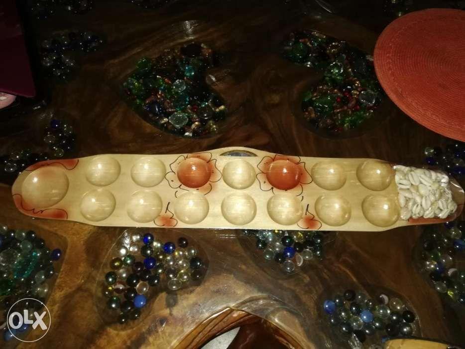 Sungka Mancala made of solid wood (Category: Vintage Collectibles) located in Manila. Submitted by lovelystuffmaycomeandgo (Listing ID 238565997, Image 2). Description: Sungka made of solid wood, lizard design with shells Black Lizard - 700 pesos Natural wood floral design - 550 pesos Note: brand new Meet-up delivery: SM Centerpoint Sta. Mesa, Cubao Area, SM Megamall, EDSA Shangrila Mall or thru JRS Express, shipping fee to be shouldered by the b