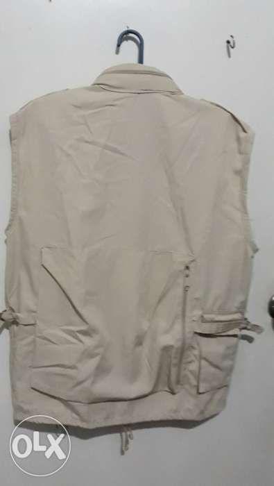 Reporter Vest jacket (Category: Rehabilitative Devices) located in Las Pinas. Submitted by hermogenesjr.p (Listing ID 238589263, Image 2). Description: This listing is hosted on Carousell on behalf of OLX Philippines. Vest jacket - cream color Different size 8 pockets with colar hood ideal for use : reporter, photographer, etc good condition 09064685377.