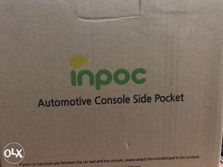 automotive console side pocket (Category: Audio, Video, Alarm and other Electronic Accessories) located in Quezon City. Submitted by robert.robert3 (Listing ID 238607277, Image 3). Description: Brand New. Factory Sealed. Known brand. Car seat catcher. Fill the gaps between the seat. Easy to install. Can store any item such as smartphone, wallet, etc Fb : smart gadgets philippines.