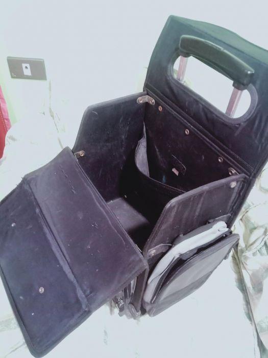 Original Hawk trolley school bag (Category: Carriers & Slings) located in Manila. Submitted by inaydearest (Listing ID 238890569, Image 2). Description: Original Hawk trolley school bag. Color Black and gray with red linings ( as seen in the picture) With four side pockets . Height = 15 inches and length= 14 inches and width=8.5 inches. Still in good condition especially the wheels and the handle. With plastic cover for rain protection Negotiable