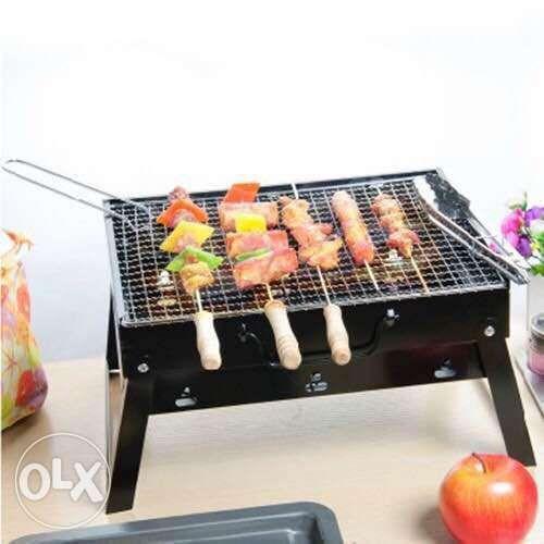 Portable And Foldable Charcoal Barbecue Grill (Category: Bakeware) located in Manila. Submitted by magicgerry (Listing ID 238905498, Image 3). Description: Portable & Foldable Charcoal Barbecue Grill (P599.00) Highlights: > Portable & Foldable Charcoal Barbecue Grill > The black table top grill is made from stainless steel that's sturdy and durable. It withstands a fair amount of heat, giving you enough time to grill your burgers, meat, and sandw