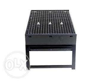 Portable And Foldable Charcoal Barbecue Grill (Category: Bakeware) located in Manila. Submitted by magicgerry (Listing ID 238905498, Image 2). Description: Portable & Foldable Charcoal Barbecue Grill (P599.00) Highlights: > Portable & Foldable Charcoal Barbecue Grill > The black table top grill is made from stainless steel that's sturdy and durable. It withstands a fair amount of heat, giving you enough time to grill your burgers, meat, and sandw