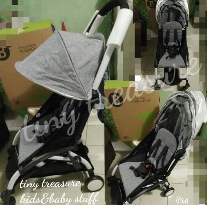 portable travel stroller (Category: Strollers) located in Manila. Submitted by mytinytreasure (Listing ID 239198011, Image 3). Description: a new travel buddy stroller portable stroller easy to carry safe for newborn up to 48kilos weight of child. stroller weight 5.8kilos only extended canopy 5 point harness removable bumper guard with bottle holder at side swivel wheels and safety lock with black bag removable shoulder strap color avail only GRA