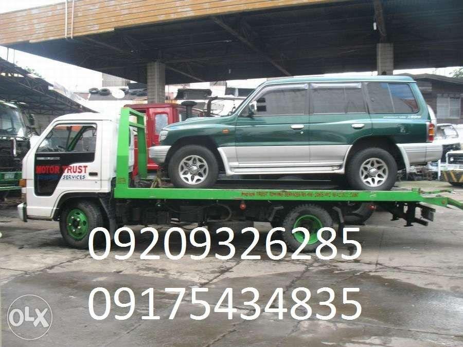 Towing Services Car carrier Wrecker and Boom truck in quezon city, Home Services, Movers