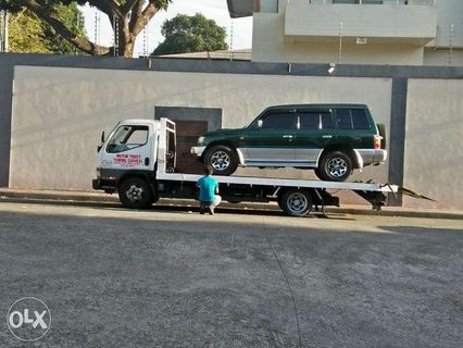 MOTOR TRUST TOWING SERVICES Car Carrier Wrecker and Boom