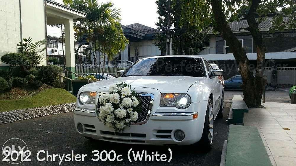 Chrysler 300c White Bridal Car (Category: Vehicle Rentals) located in Makati City. Submitted by aperfectdaywedcar (Listing ID 239327373, Image 2). Description: White CHRYSLER 300c Rental Service for: Bridal car Photo Shoots Commercials AVP's Events Because You Deserve The Best "White Bridal WEDDING CAR Chrysler 300c" RENTAL RATE: Php 6,999 for the first 3 hours; ***Package includes a uniformed driver, gas, and car bouquet. ***for Metro Manila rat