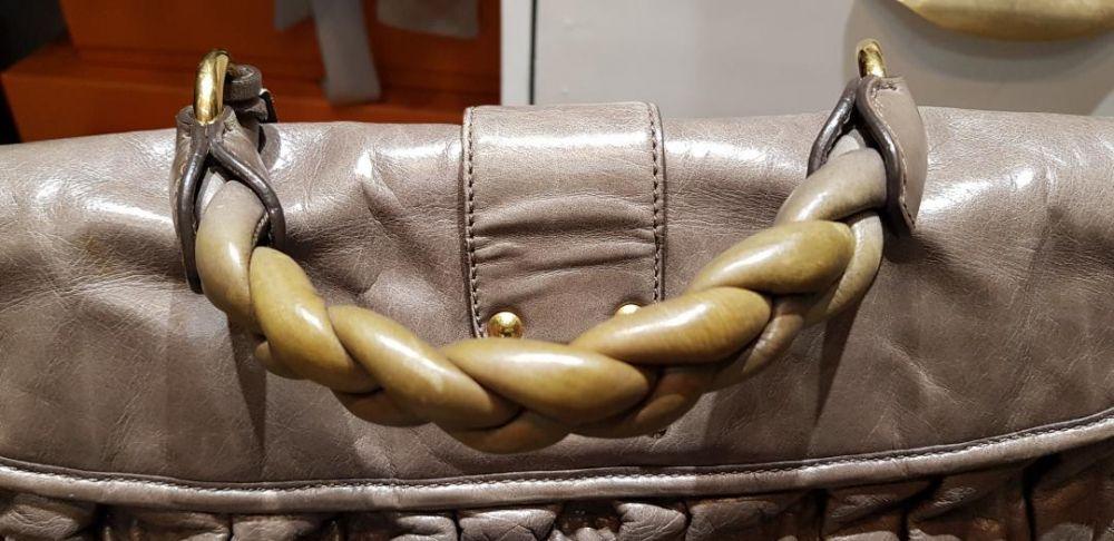 Miu Miu Matelasse Lux Bag (Category: Luxury Bags & Wallets) located in Quezon City. Submitted by titamanang (Listing ID 239330579, Image 3). Description: Brand & Style: MIU MIU Matelasse Color: Argilla Dimensions: 28cm H x 38cm W x 12.5cm D Inclusions: None - 2 way style - 2 front snap pockets - 1 inside zip pocket - 1 inside slip pocket - Gold hardware - Adjustable shoulder strap - Luxurious leather - Made in Turkey Discoloration on handle. Mino