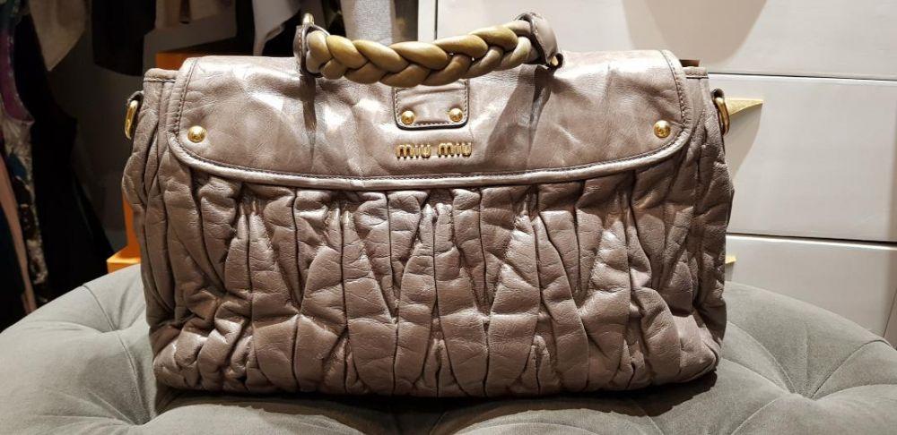 Miu Miu Matelasse Lux Bag (Category: Luxury Bags & Wallets) located in Quezon City. Submitted by titamanang (Listing ID 239330579, Image 2). Description: Brand & Style: MIU MIU Matelasse Color: Argilla Dimensions: 28cm H x 38cm W x 12.5cm D Inclusions: None - 2 way style - 2 front snap pockets - 1 inside zip pocket - 1 inside slip pocket - Gold hardware - Adjustable shoulder strap - Luxurious leather - Made in Turkey Discoloration on handle. Mino