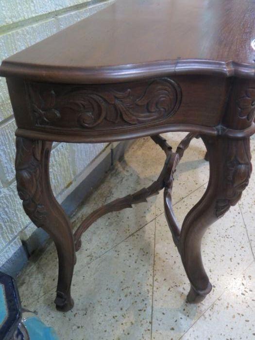 Antique console narra table (Category: TV Consoles) located in Manila. Submitted by margaritan.gomez (Listing ID 239348669, Image 2). Description: This listing is hosted on Carousell on behalf of OLX Philippines. A console table from the first quarter of the 20th century made of narra wood. The serpentine-shaped, groovings, and rounded corners of the top are echoed by the curvy lower components of the table. While the front frieze that holds the 
