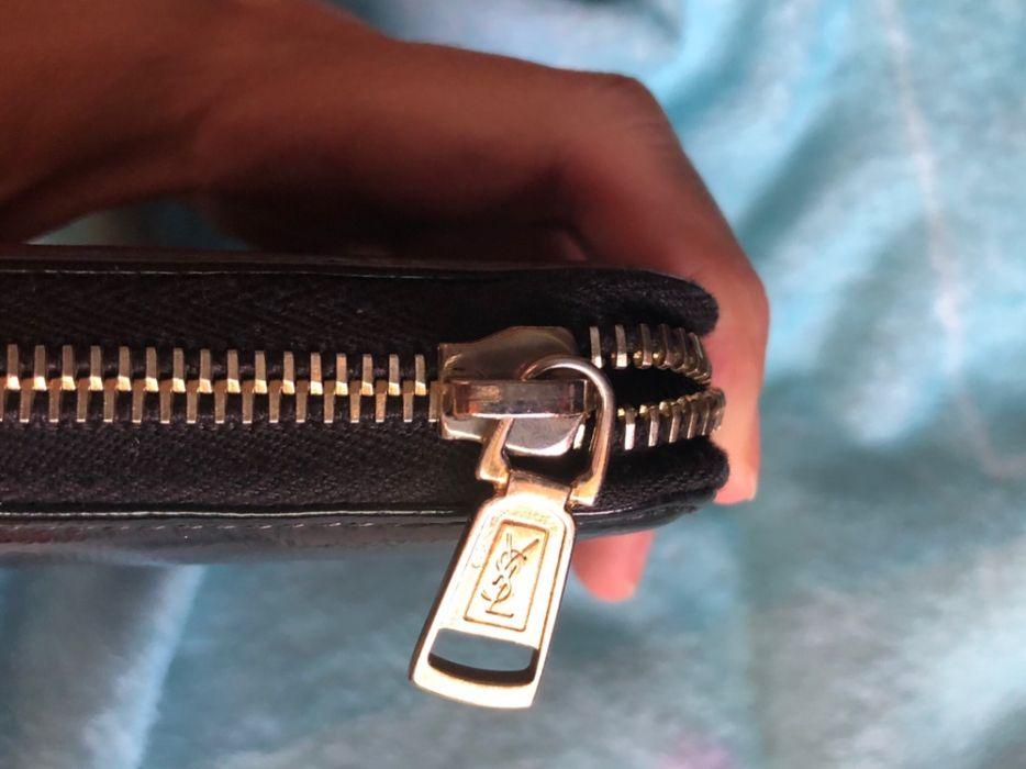 YSL wallet (Category: Luxury Bags & Wallets) located in Manila. Submitted by mybaghabit14 (Listing ID 239351142, Image 3). Description: Ysl belle de jour wallet Preowned but very good condition. A little tanish on zipper and some scratches on the back- Puchased from japan Comes with care Rfs: decluttering.