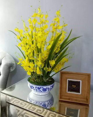 Artificial orchid with ceramic vase