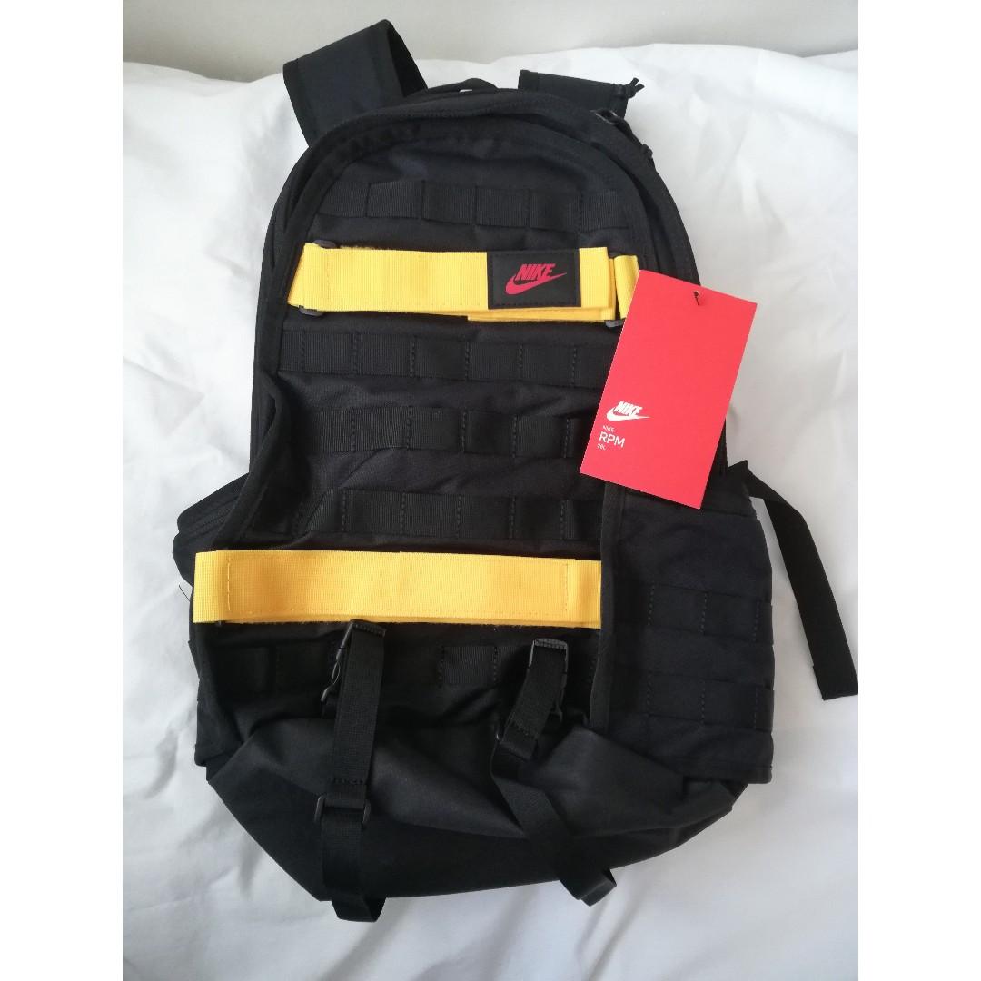 black and yellow nike backpack