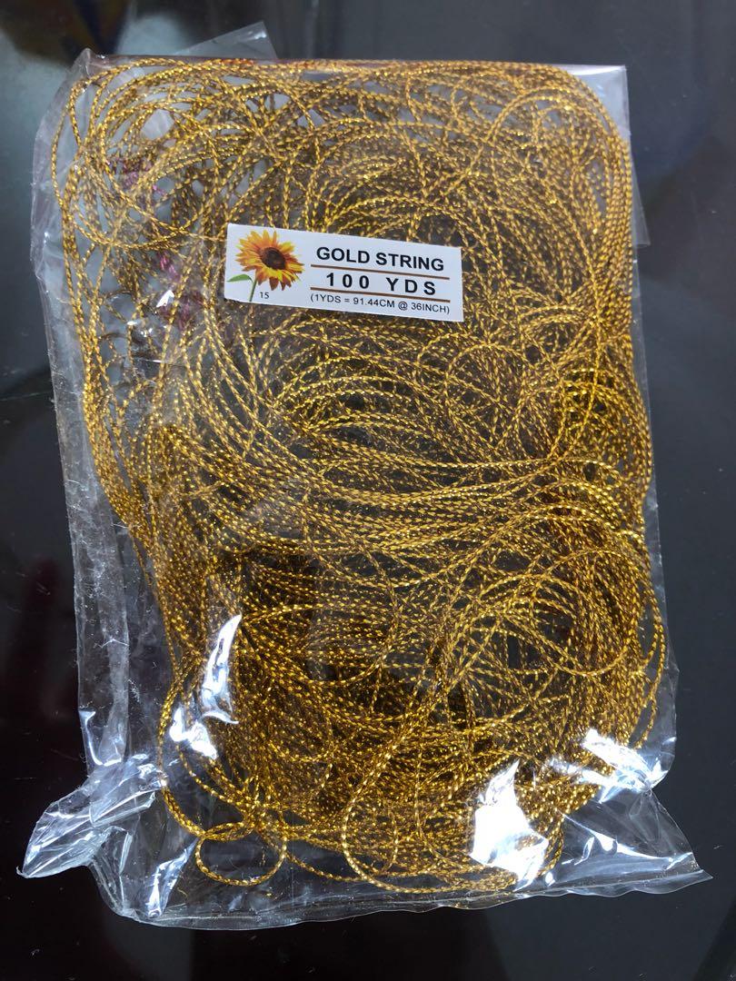 Gold string (Category: Occasions & Party Supplies) located in Singapore. Submitted by tsumcy (Listing ID 240823269, Image 1). Description: Can use to tie wedding invites or other decorations. .