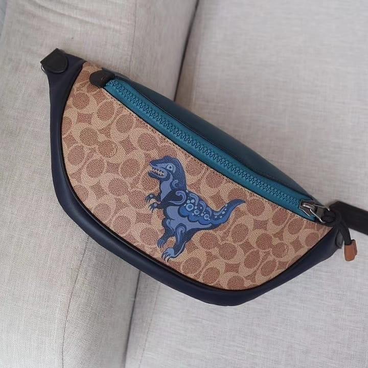 Coach Rivington Belt Bag In Signature Canvas With Rexy By Zhu