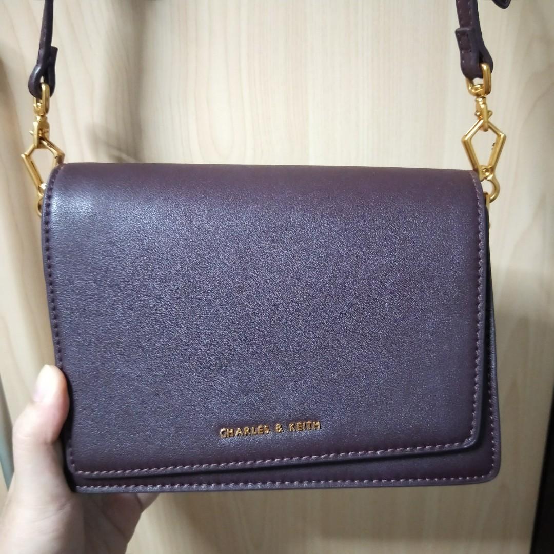 Charles Keith Asymmetric Front Flap Sling Bag in Burgundy Women s Fashion Bags Wallets Cross body Bags on Carousell