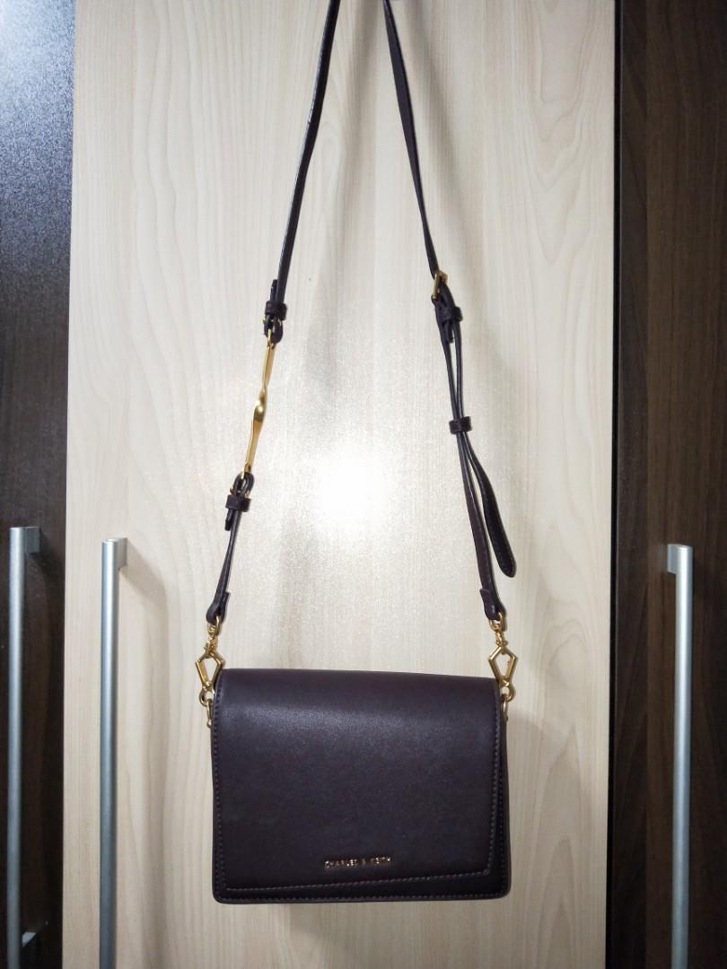 Charles Keith Asymmetric Front Flap Sling Bag in Burgundy Women s Fashion Bags Wallets Cross body Bags on Carousell