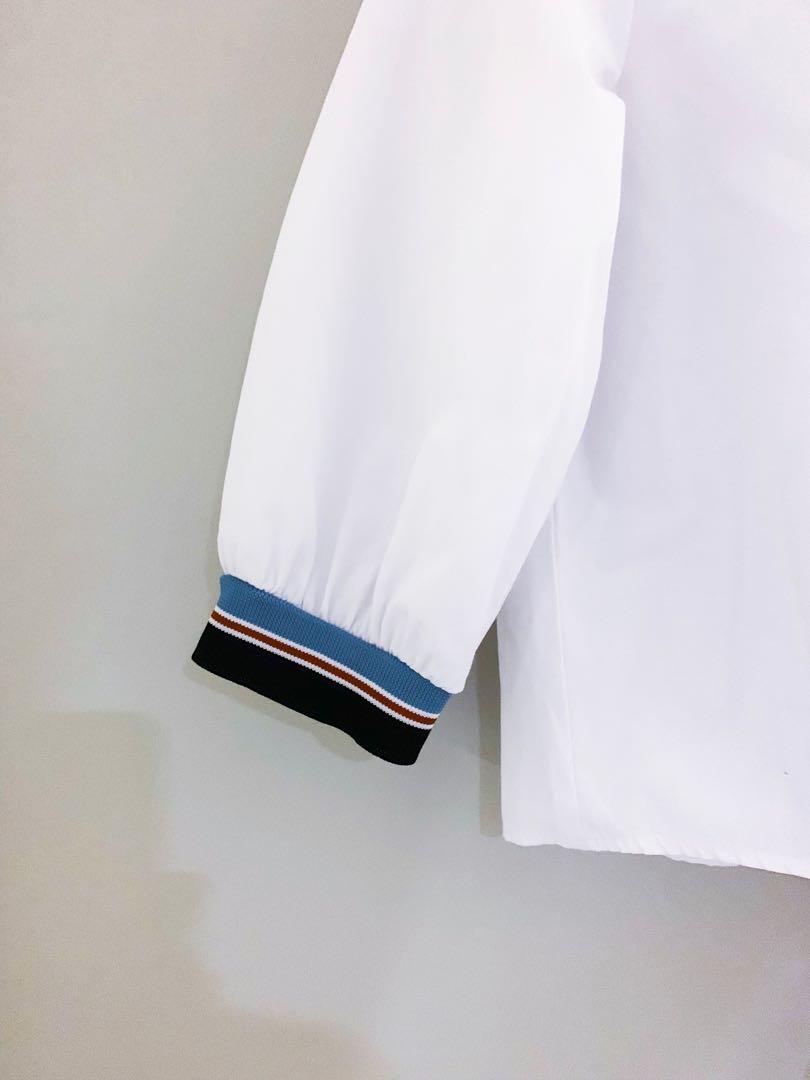 Stradivarius Front Tie White Top (Category: Others Tops) located in Muntinlupa City. Submitted by andreadaniela (Listing ID 241895029, Image 3). Description: Great condition! White quarter sleeved too with red, white, & blue details and front tie. (No when worn photos at the moment).