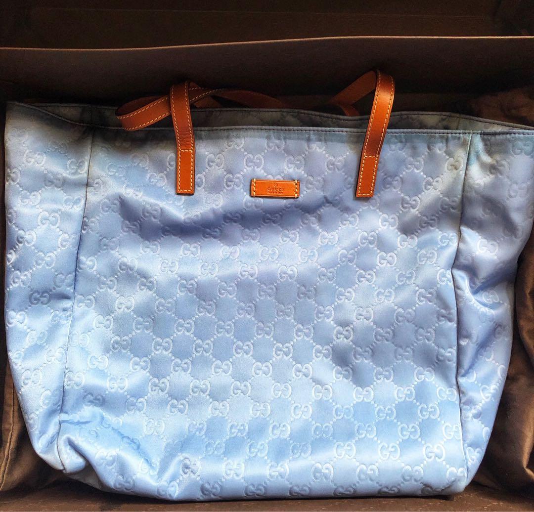Blue GG Nylon Tote (Category: Luxury Bags & Wallets) located in Quezon City. Submitted by _falalala (Listing ID 242018379, Image 1). Description: Authentic Complete with paper bag, dustbag, box and card Few stains inside (see photo) RFS: not using it anymore.