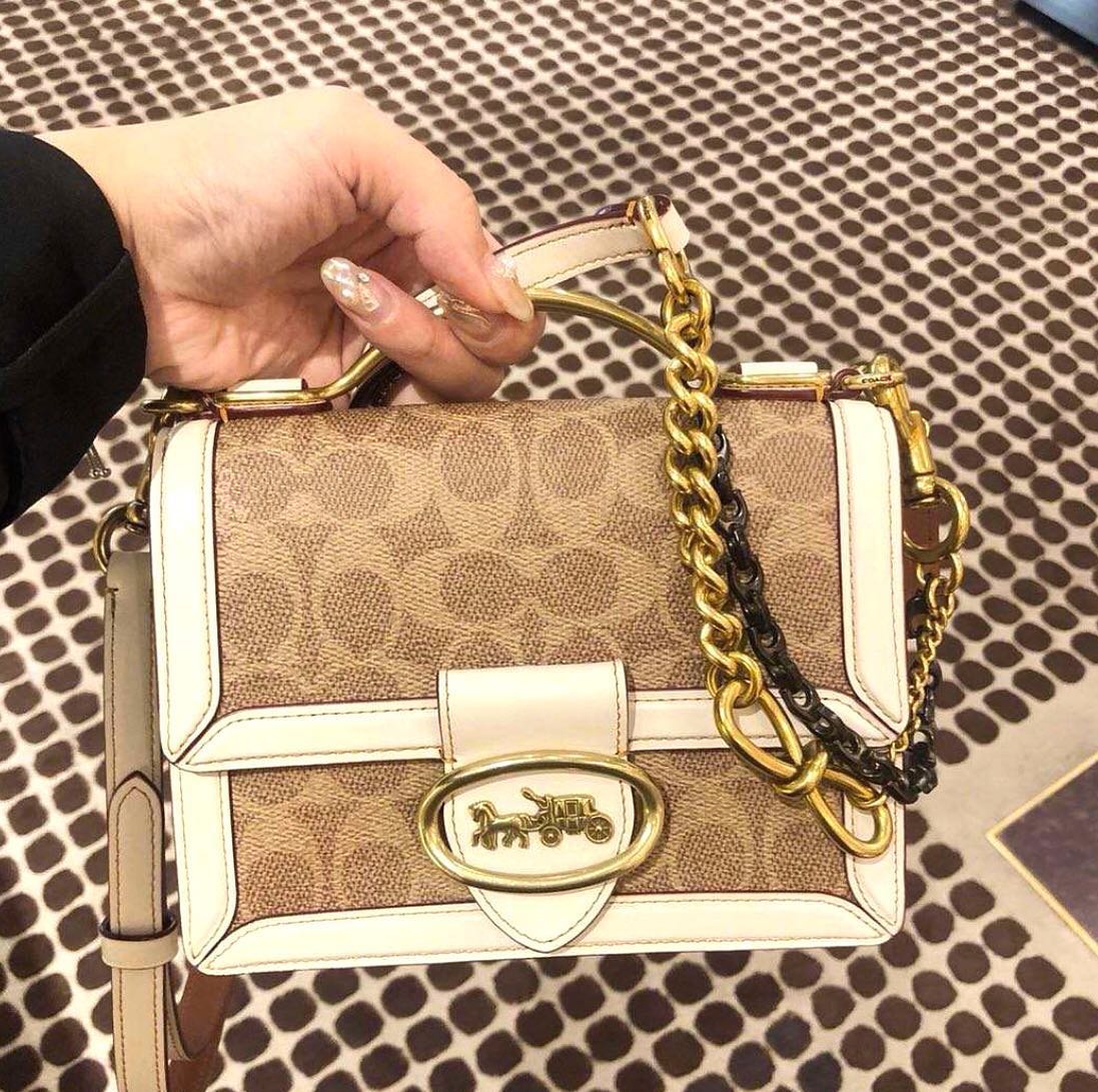 coach riley top handle 18 in signature canvas