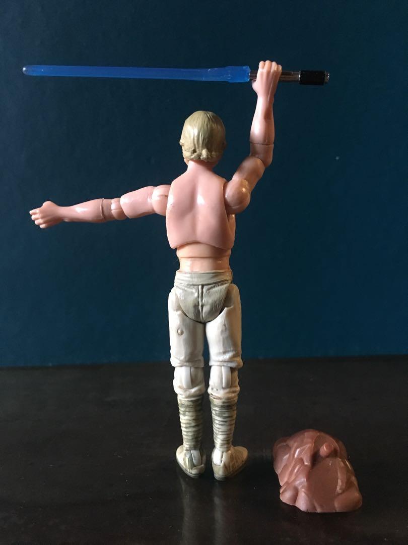 STAR WARS JEDI TRAINING LUKE (CUSTOM) (Category: Figurines & Statues) located in Makati City. Submitted by tudortiger2000 (Listing ID 242054755, Image 3). Description: JEDI TRAINING LUKE (CUSTOM) Hasbro, 1:18 / 3.75" scale figure BIO: This custom Luke figure depicts his Dagobah Jedi training. The figure comes from the OTC farm boy Luke with the Bespin Escape Luke lightsaber and the Saga Collection Clone Trooper rock base, as accessories. POA: - b