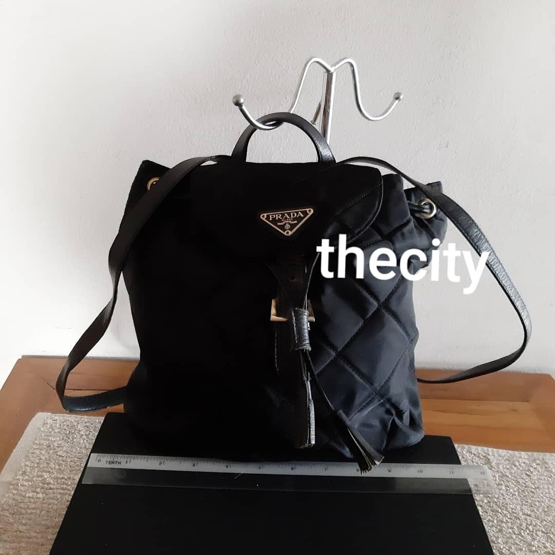 AUTHENTIC PRADA BLACK NYLON CANVAS QUILTED BACKPACK - WITH TASSEL CHARMS -  CLEAN INTERIOR - (PRADA BACKPACKS NOW RETAIL OVER RM 5500+), Luxury, Bags &  Wallets on Carousell