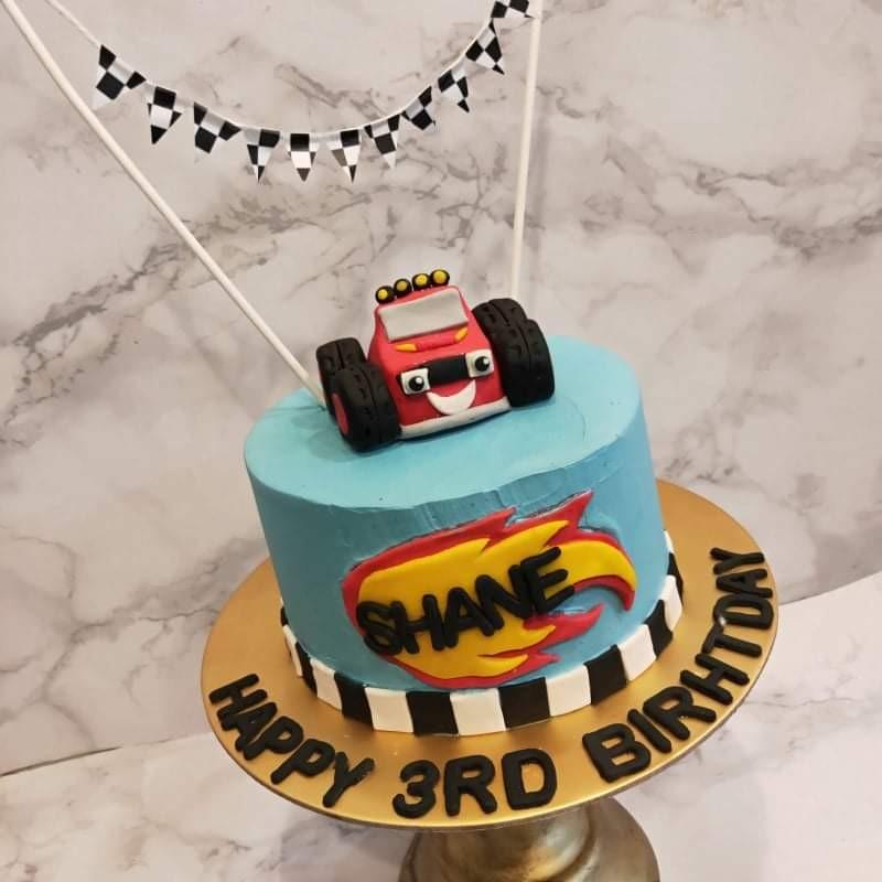 Blue race car cake | Cars birthday cake, Race car cakes, First birthday  cakes