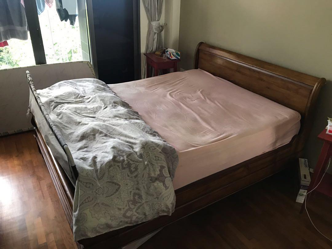 Solid Wooden Bed Frame (Category: Bed Frames & Mattresses) located in Singapore. Submitted by sent69 (Listing ID 242514182, Image 1). Description: Solid bed frame well taken care. Bought for more than double the asking price. Self collect from Yishun, if delivery is required will quote separately. Moving house so need to let go soon * Mattress not included .