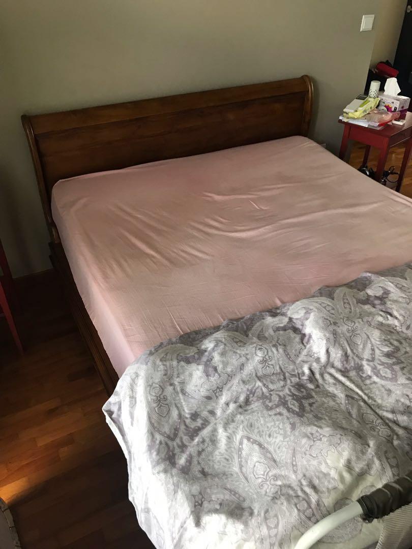 Solid Wooden Bed Frame (Category: Bed Frames & Mattresses) located in Singapore. Submitted by sent69 (Listing ID 242514182, Image 3). Description: Solid bed frame well taken care. Bought for more than double the asking price. Self collect from Yishun, if delivery is required will quote separately. Moving house so need to let go soon * Mattress not included .