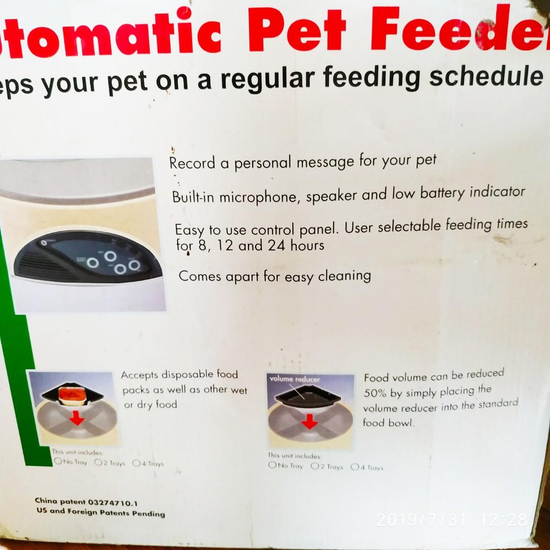 Automatic Pet feeder with message recorder and timed feeding (Category: Homes & Other Pet Accessories) located in Manila. Submitted by greatbabystuff (Listing ID 242975168, Image 2). Description: Used only a few times, works perfectly. You can set the feeder to open at regular intervals, and record a message for your pet, which will play at mealtimes..