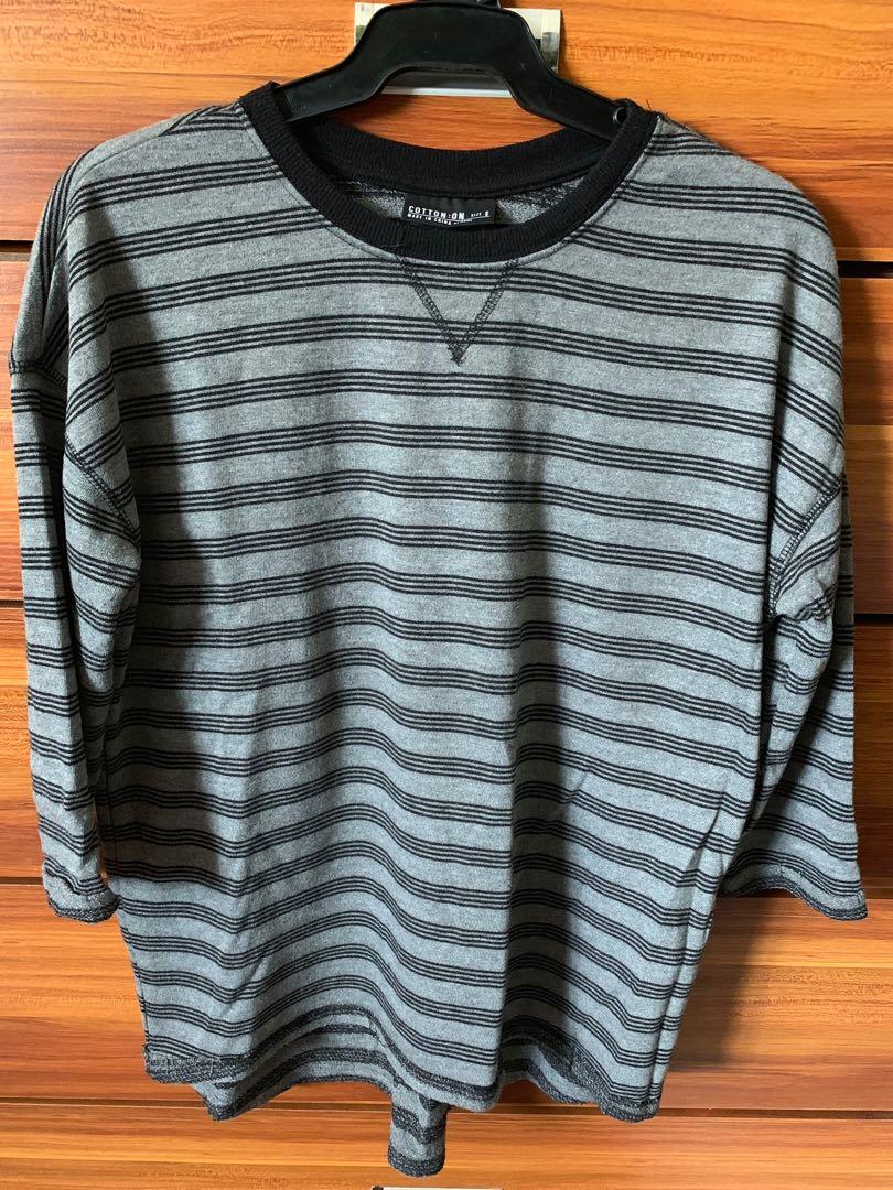 Cotton on Grey stripes 3/4 sleeves tshirt (Category: Longsleeves) located in Manila. Submitted by moziyah (Listing ID 243350668, Image 1). Description: **Size on shirt maybe small but can fit medium built **100% cotton **no stains or damages **looks brand new **comfy during rainy season **bought from sydney **RFS: decluttering.