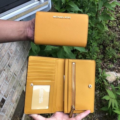 💯 ORIGINAL Michael Kors Jet Set Travel Slim Bifold Wallet in Marigold,  Luxury, Bags & Wallets on Carousell