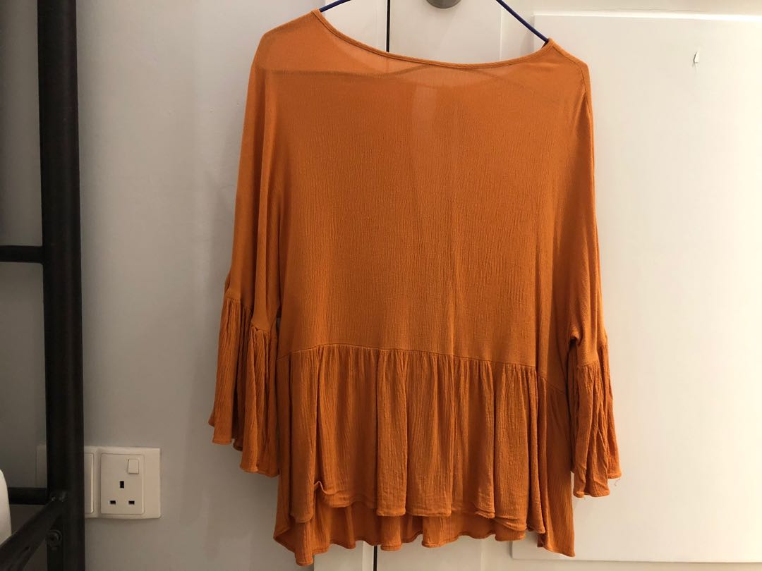 orange flowy top
