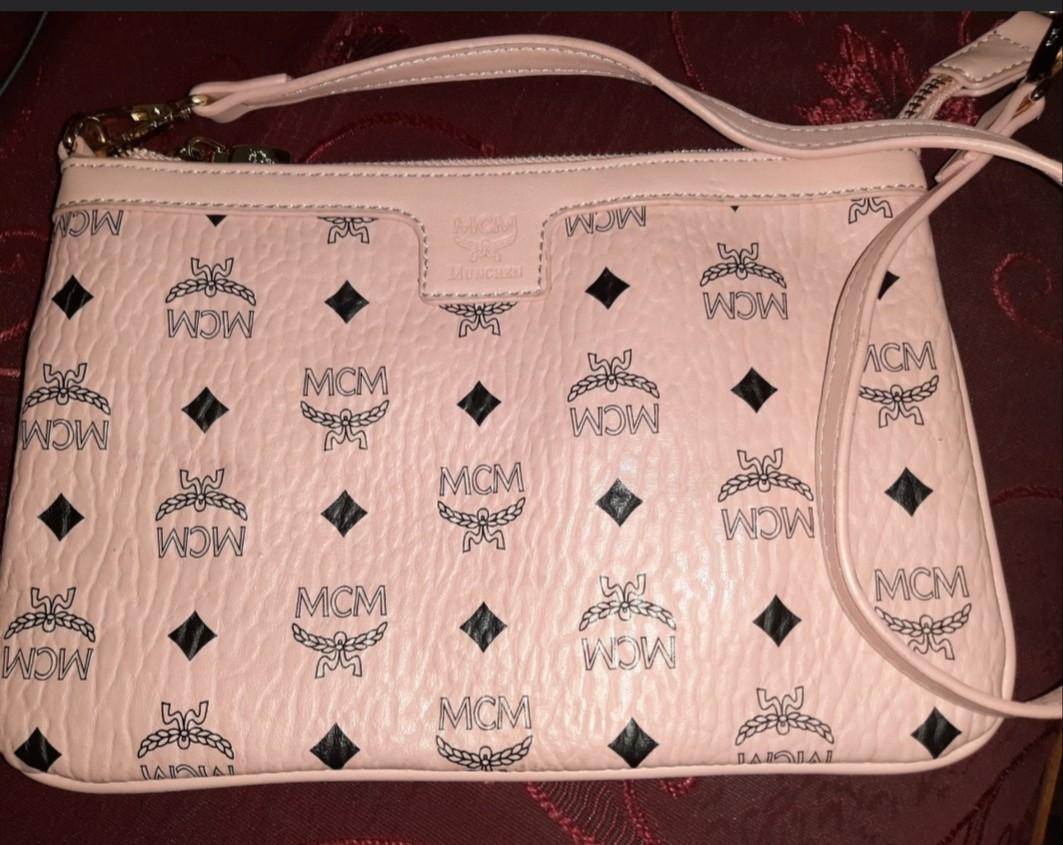 MCM POCHETTE (Category: Purses & Pouches) located in Pasig City. Submitted by theluxbaghunter (Listing ID 244173012, Image 1). Description: Good condition Sign of minor use #choosetocare.