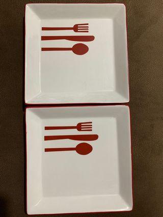 Red and cream ceramic plates