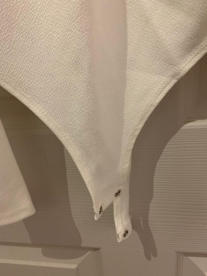 Dynamite (Category: Clothes) located in Toronto. Submitted by evsells (Listing ID 244215908, Image 3). Description: White bodysuit from Dynamite Brand new, never been worn Button for body suit Size xsmall.