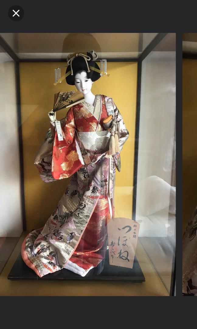 japanese doll in glass case