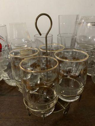 Vintage 4-piece set of gold-designed drinking glasses with rotating container