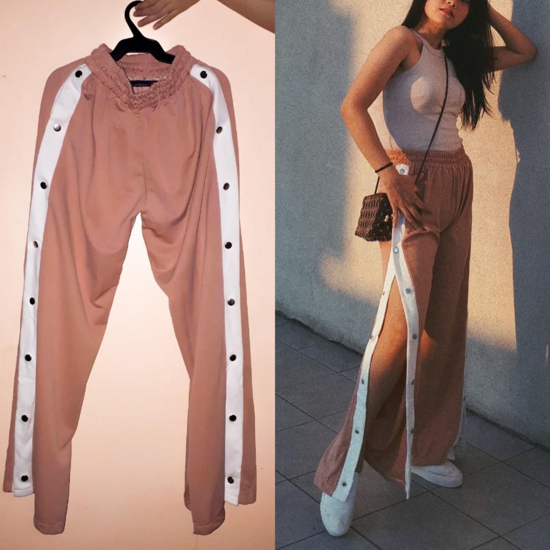 Track pants with buttons shop on side