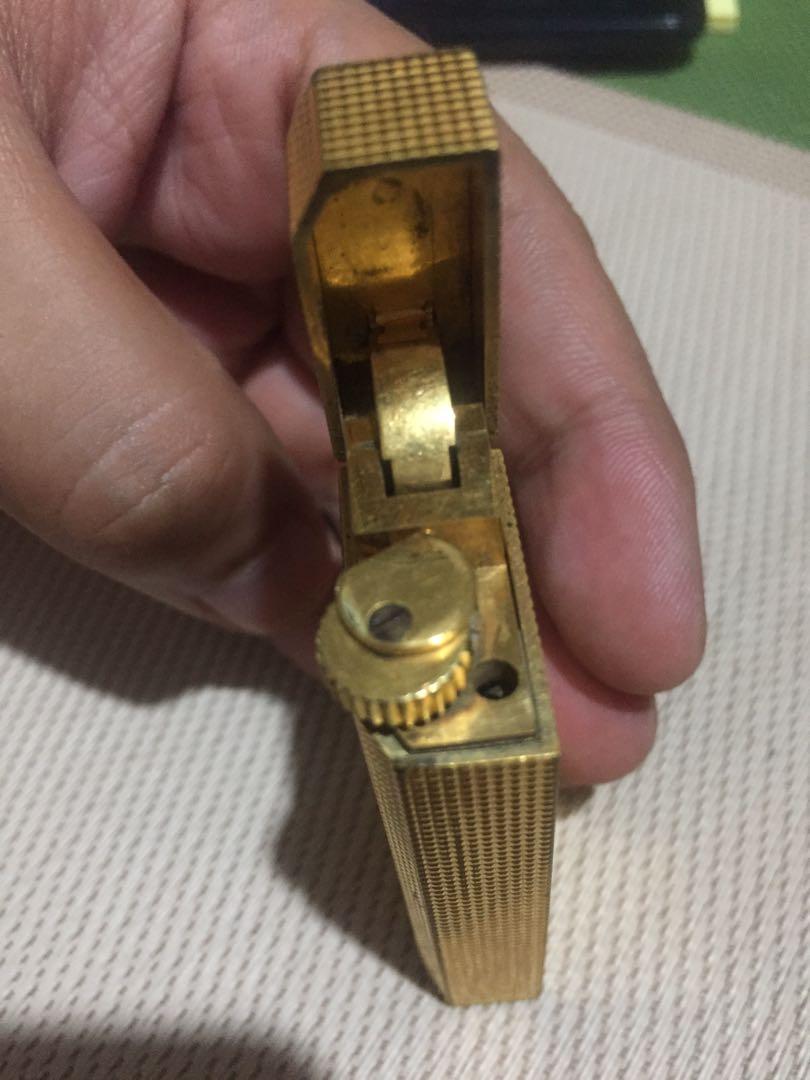 Cartier Lighter 5 Faces Gold (Category: Luxury Accessories) located in Pasay City. Submitted by derekuygo (Listing ID 245652278, Image 3). Description: Cartier lighter 5 faces in gold of the years 80 The lighter has been completely overhauled and is therefore guaranteed original but theres a malfunction on upper( need oil i think) and bottom part based on picture there a defect not using it anymore kindly pm me for interesred 09270094318 .