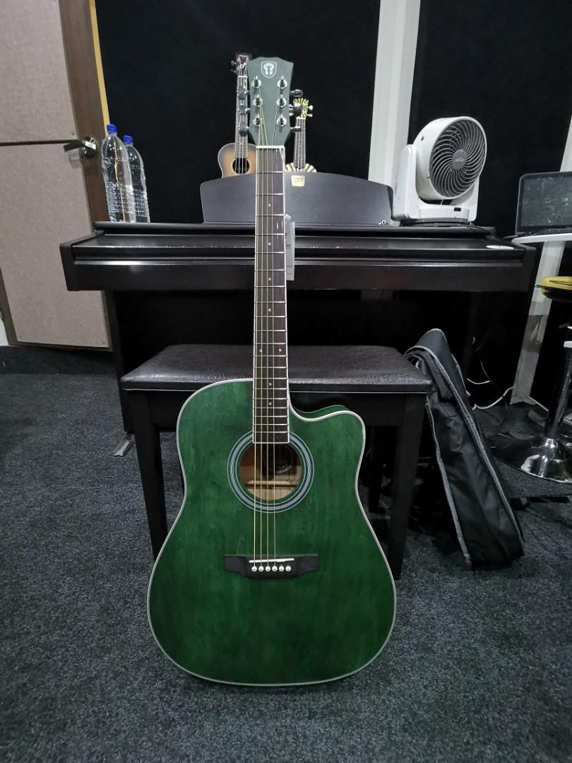 black and green guitar