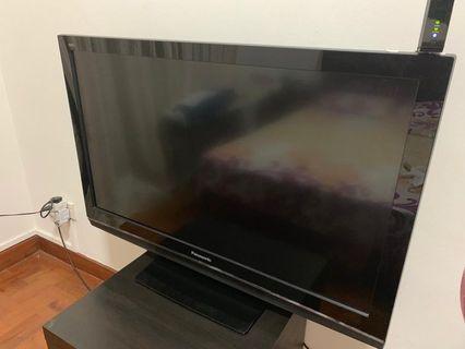 Tv along with the small Tv console for sale