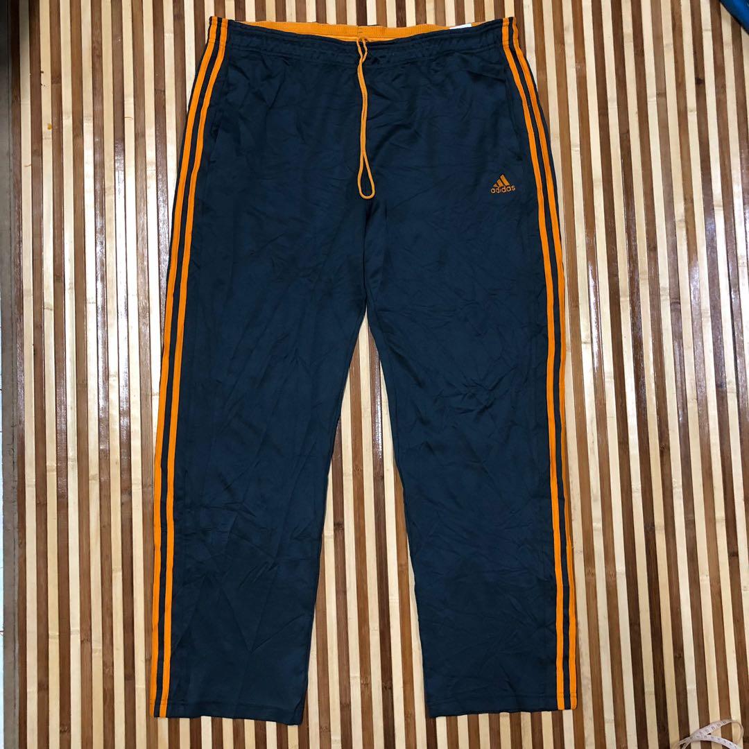 grey and orange adidas pants