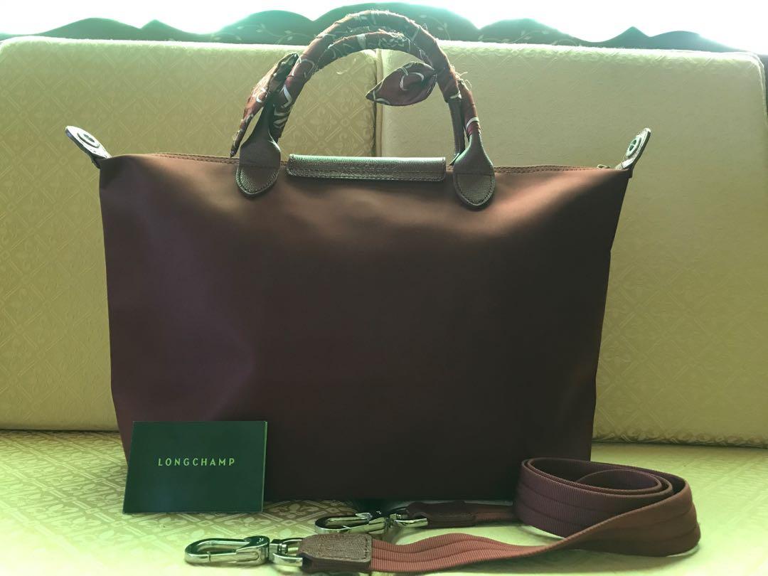 Longchamp Le Pliage Neo Opera Red Medium Bag (Category: Luxury Bags & Wallets) located in Bulacan. Submitted by collectionsofashopaholic (Listing ID 246370412, Image 2). Description: PLEASE TAKE TIME TO READ ALL THESE: 🙂Longchamp Le Pliage Neo opera red medium bag 🙂Color is opera red. Very spacious. Comes with matching twilly and its care card. 🙂Guaranteed original/authentic. 🙂Very good used condition. This is my preloved bag. Have owned this
